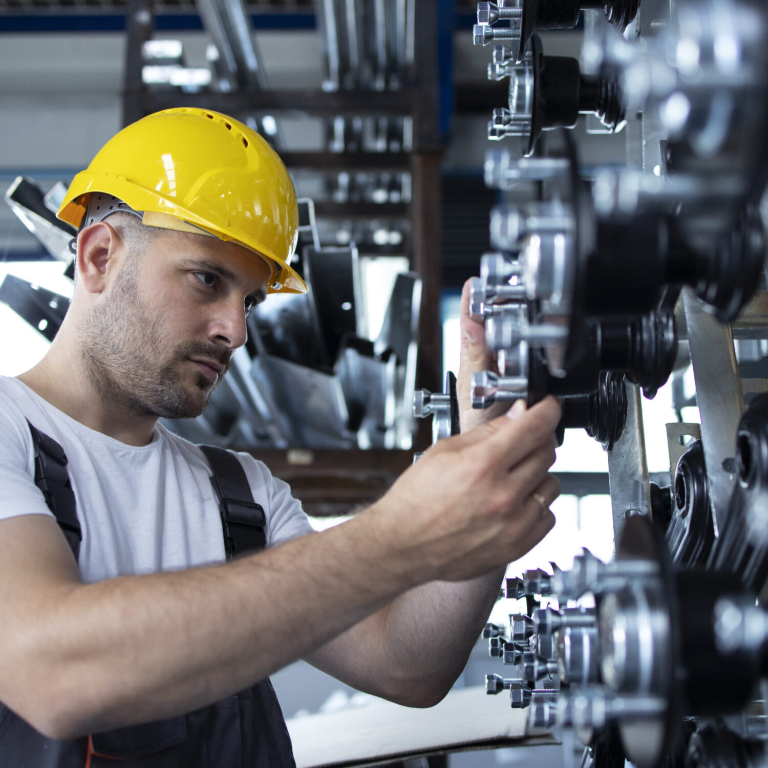 Industrial worker working at production line in factory.